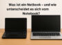 Netbook und Notebook im Größenvergleich auf Holztisch